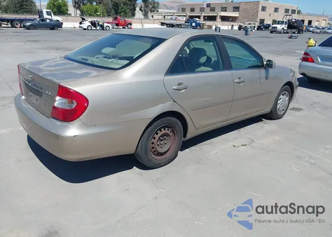 2002 Toyota Camry Le из США, поврежденный, VIN JTDBE30K520119789